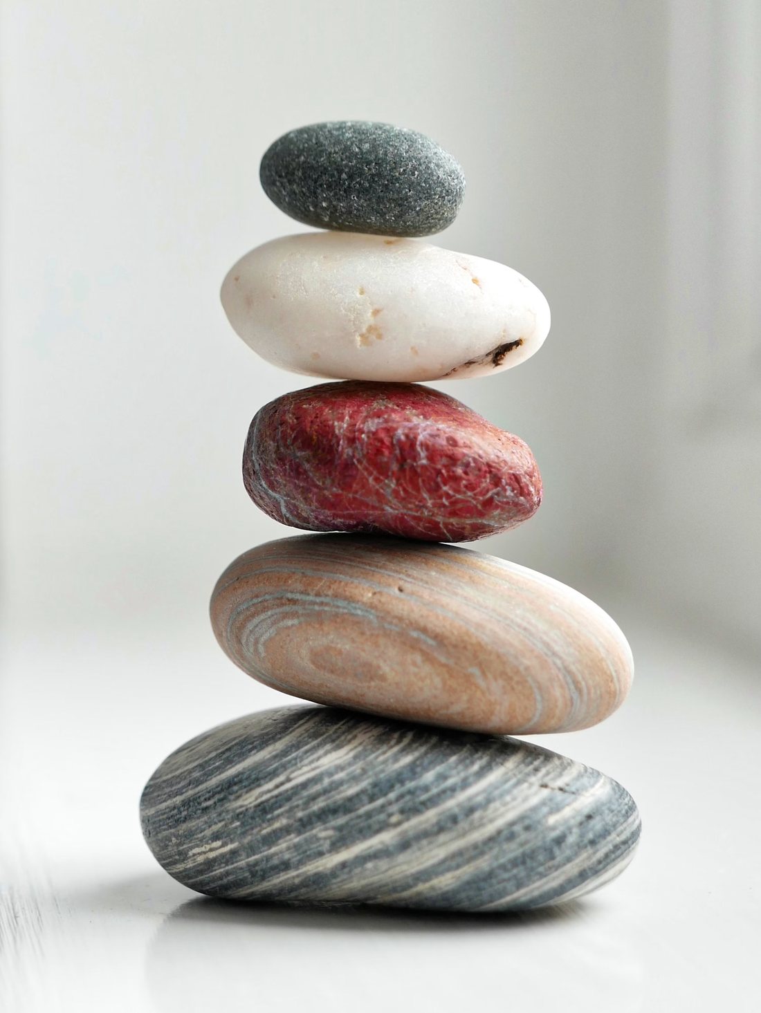 A balanced stack of smooth stones, a symbol of calm and balance